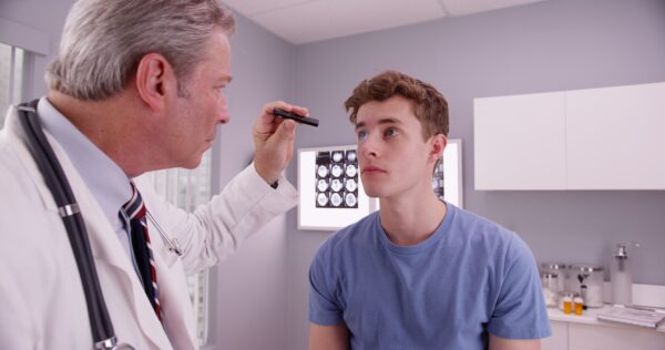 Doctor examines a patient's eyes